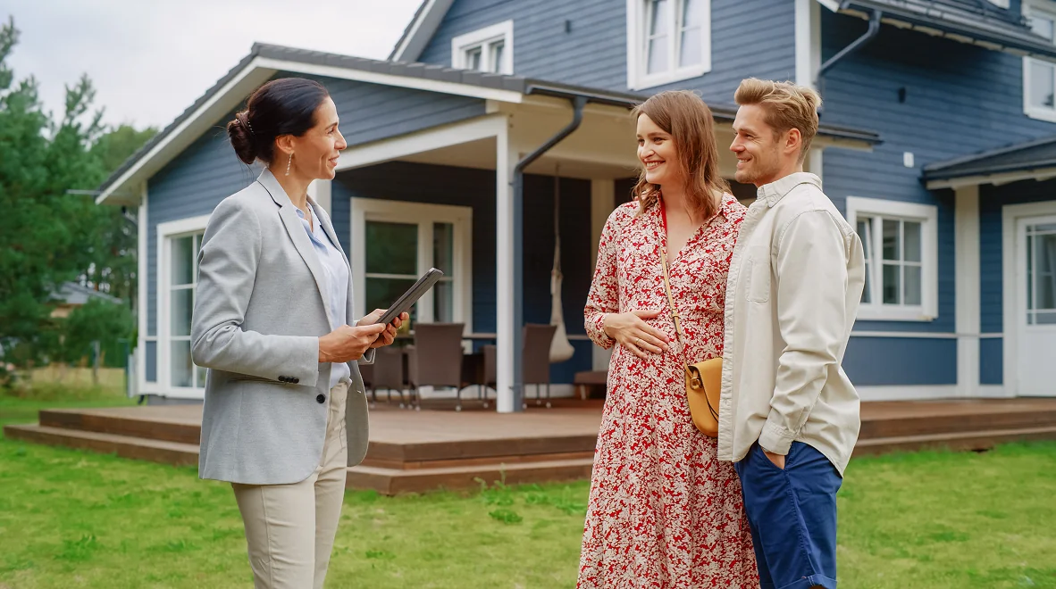 Realtor showing house to a couple.